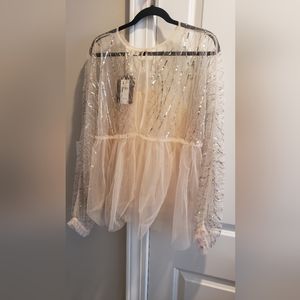 Anthropologie tulle top with sequins.
